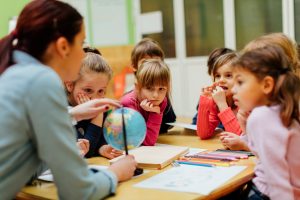 School children learning about the Earth